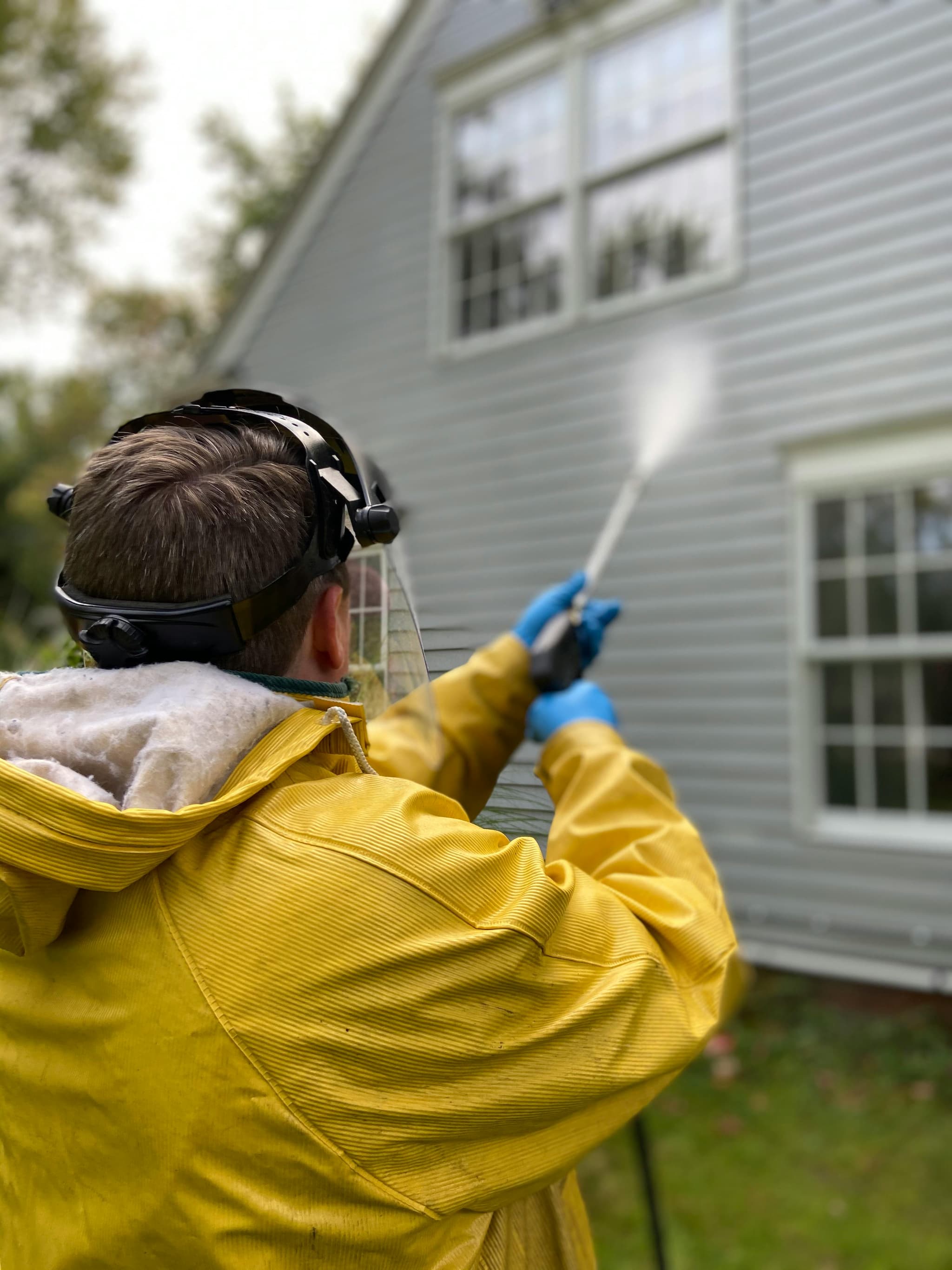 House exterior being power washed